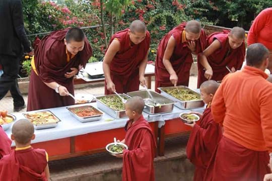 Kunchuk la helps serve the young nuns