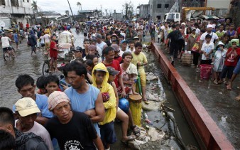 This photo shows just how devastating the effects of climate change can be to the world. Pictured are thousands of individuals struggling to regain solid ground after Super Typhoon Haiyan demolished the Philippines 