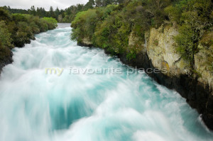 Powerful surge of water through narrow gorge Waikato River near Taupo