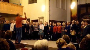 Bruce Knight conducting Songlines Community Choir in a performance of Nkosi Sikelelik 'lAfrika in St Mary's Church Leamington Spa on Saturday 7 December 2013