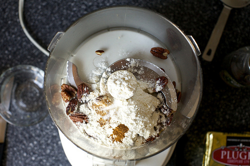 grinding the pecans with flour and spice