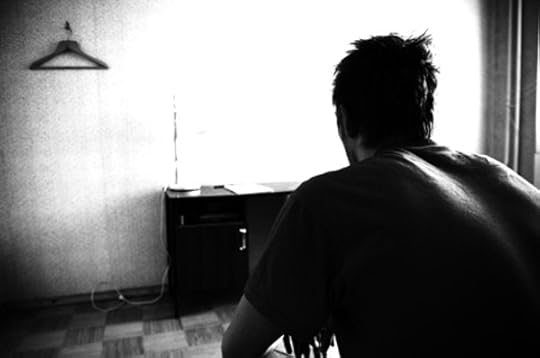 Man staring at wall