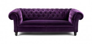 Chesterfield couch, in royal purple - just perfect for our distinguished guest on tonight's show.