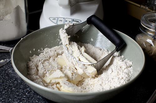 cutting butter into flour and spices