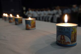 US_Navy_070426-N-4965F-003_Six_memorial_candles_are_lit_during_a_Holocaust_Remembrance_Day_ceremony_at_Sharkey_Theater_on_board_Naval_Station_Pearl_Harbor