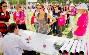 Author signing books at 2012 National Book Festival