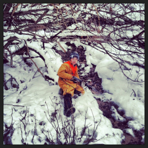 Cole sits beside the fresh water spring. 