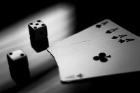 Lucky seven on the dice and four aces from the card deck