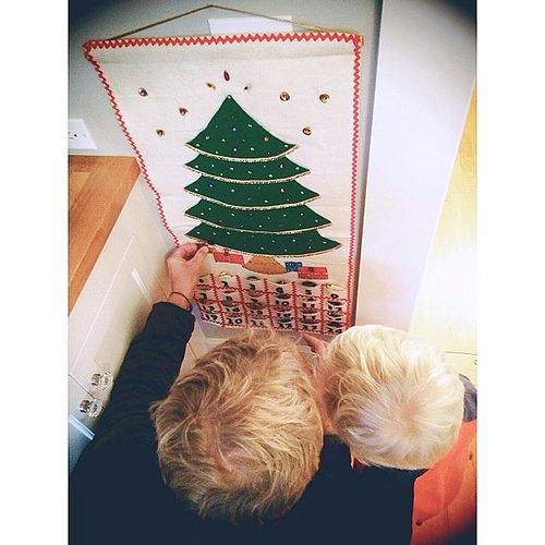 So love this shot/moment of John showing True how the advent calendar works. The handmade calendar is from John's childhood, crafted by his mother and grandmother. #special