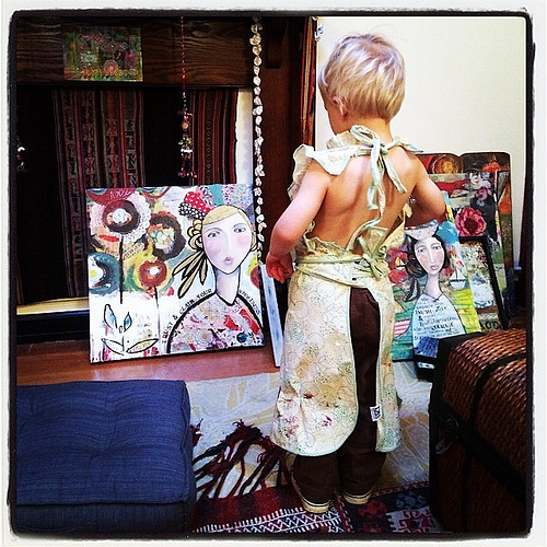 Adore this photo of True checking out his mama's art while wearing one of her aprons. #sigh #trueelioorlando Love having him at my studio.