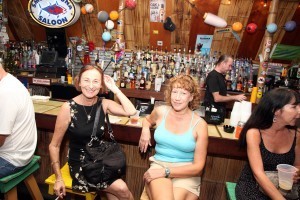 Two ladies one from one end of book tables to the other end and, luckily there was a bar at both ends waiting for them. Only in Key West!