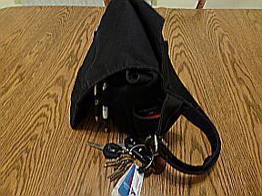  Key caribiner, phone pocket (modified), double strap pretending to be single.