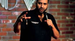 Dave Attell on stage at The Improv