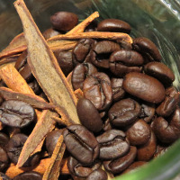 Crushed cinnamon sticks mixed with coffee beans.
