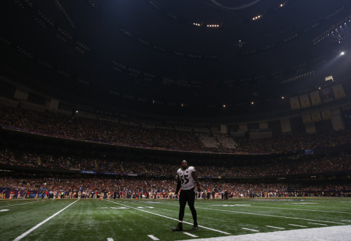 Baltimore Ravens' Suggs waits on the field after the half the lights went out in the third quarter against the San Francisco 49ers in the NFL Super Bowl XLVII football game in New Orleans