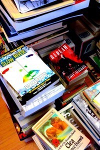 Picture of books stacked in a hallway