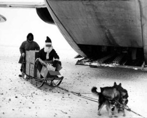 A team of huskies pulled Santa and a sled full of toys away from a C-123 plane at Savoonga, on St. Lawrence Island, in 1963. Frost built up on the driver’s parka on that minus 20-degree temperature day.