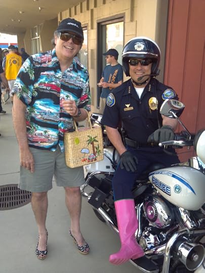 Robb stands next to the Redding Chief of police at the Walk a Mile event
