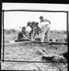 Placing te cornerstone of the Ecol house, Montreal, June, 1972. From left to right, Salama Saad, Witold Rybczynski, Arthur Acheson, Samir Ayad, and Wajid Ali.