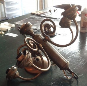 A thrift store chandelier that will become the top half of a candelabra.