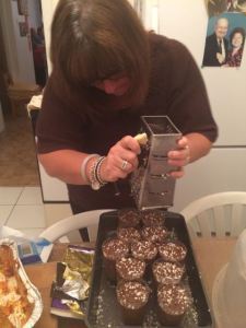 The traditional shaving of the chocolate onto the chocolate mousse.