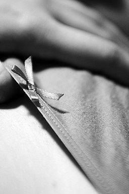 Female with hands on its panties in B&W
