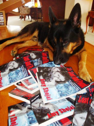 Magic with pile of Lost & Found books