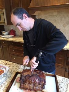 Rob mans the carving station. On the menu: prime rib.