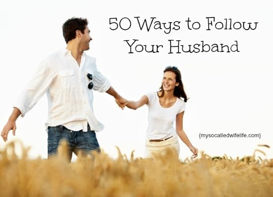 Handsome young guy leading his smiling girlfriend through a corn field