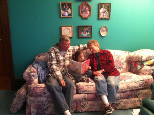 Reading Pinkalicious to Grandma and Grandpa