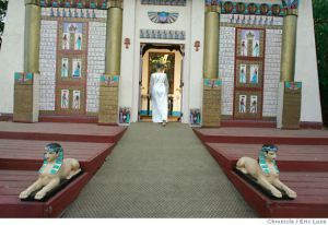 A modern priestess of Isis enters the temple at Isis Oasis