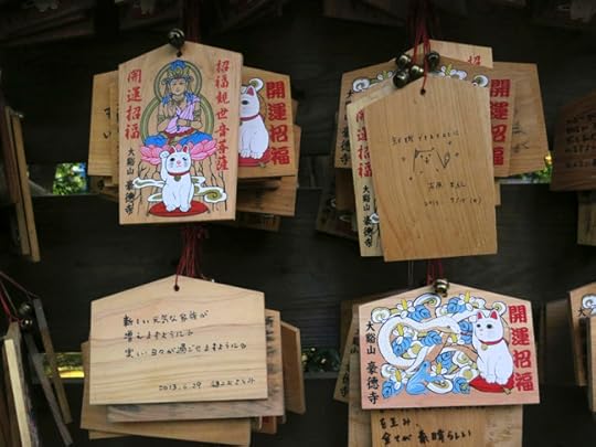 Even the prayer plaques at Gotokuji feature cats. My favorite one, though, is the one someone drew on the back of the ema in the upper right!