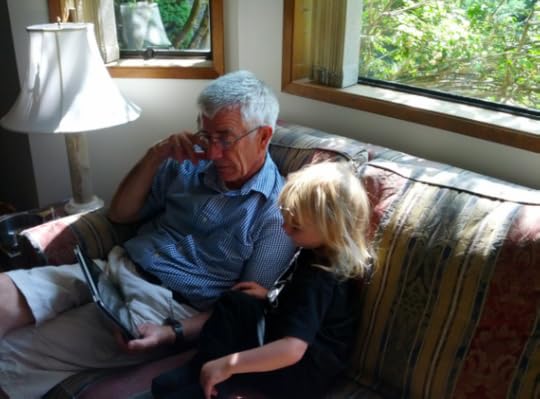 The author reading to his grandson