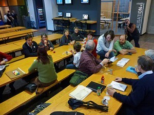 Just beginning to gather in the lunch area. Hard choice between talking and eating being made by many