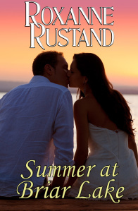 couple kissing at sunset sitting in jetty