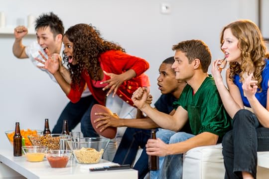 Young adults watching football