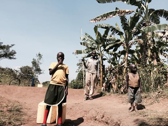 African child standing by the well