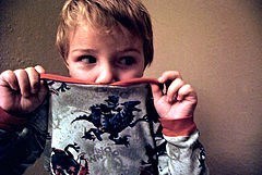 toddler covering mouth