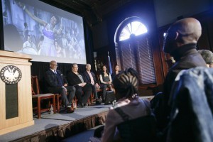 Members of Max Roach’s family (onstage) take in a film clip featuring their father on drums. Photo by Shealah Craighead
