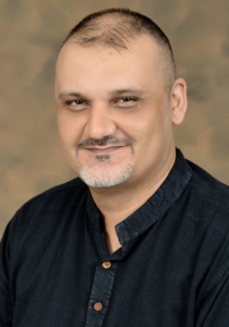 Khalid Muhammad 210x300 Agency Rules—Never an Easy Day at the Office