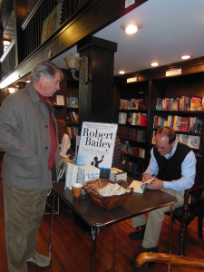 Signing a book for Bob Mackenzie