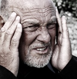Senior man suffering from severe headache
