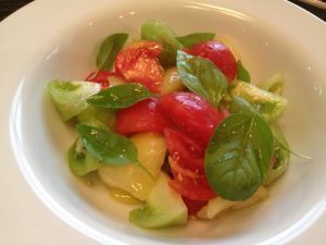 Market fresh tomato and basil salad with olive oil.