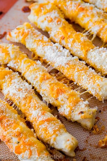 Super cheesy garlic breadsticks made from scratch. Soft & fluffy, your family will love them!