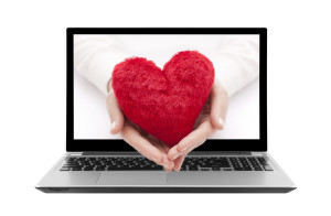bigstock-Laptop-with-red-heart-in-woman-48699554
