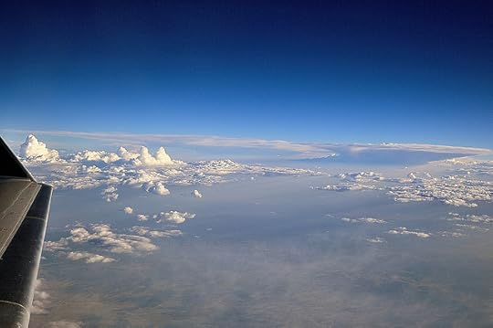 Patterns of Clouds off and Airplane Wing