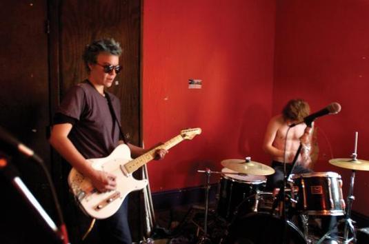 For the record, the guitarist here? This is her. If I'd been a) younger, b) unmarried, c) not with my now-husband, then I'd have let this woman show me some really stellar months and maybe years before I had to go back to men. Unf. She's so damn hot. The only woman really-truly-exists-in-reality-me has ever been attracted to in my life. 