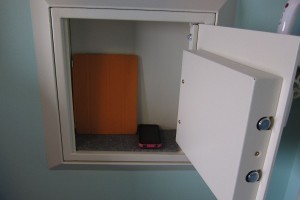 Art of Animation wall safe. That's an iPad and iPhone inside. The depth is somewhat misleading because the thickness of the door intrudes upon that space.