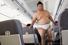 Picture credit: Superstock. Pacific Island Sumo wrestler on a plane