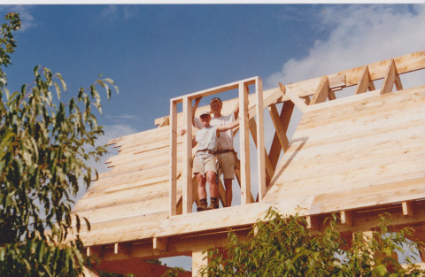 Penny and me, standing in the framed dormer wall of my office. I'm looking out this window opening right now